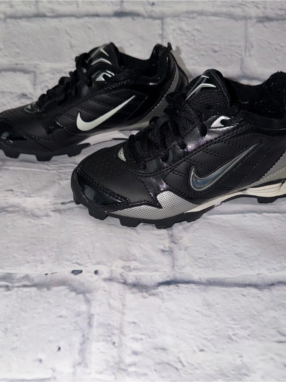 Nike Kids Black and Silver Cleats